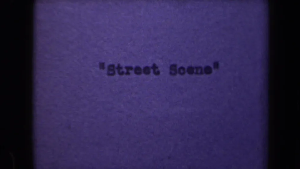 1946 8mm title card for a Netherlands home movie segment, reading "Street Scene" against a faded purple film background.