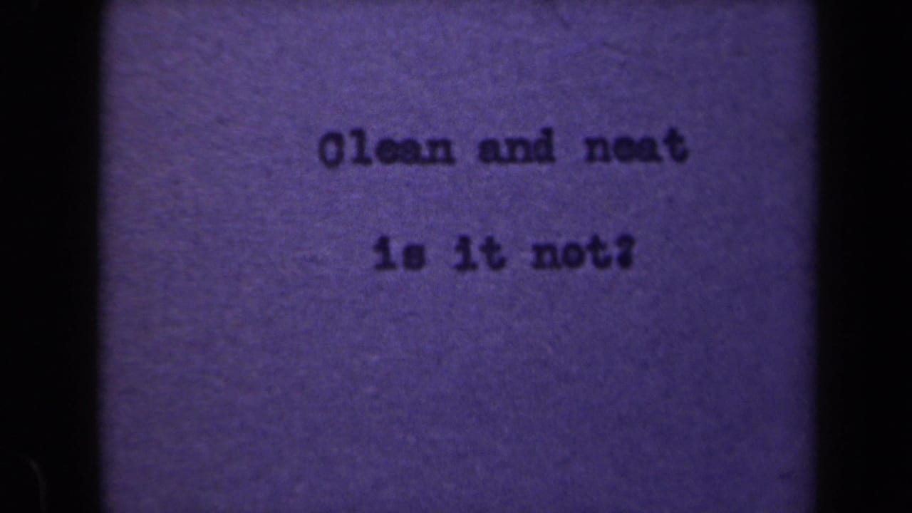 Typewritten phrase centered on purple paper with grain and dark borders.