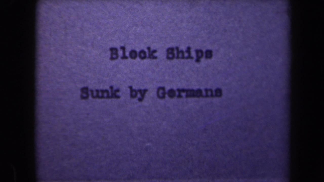 Purple-toned 8mm title card repeats "Block Ships Sunk by Germans," with grain, soft focus, and visible gate borders.