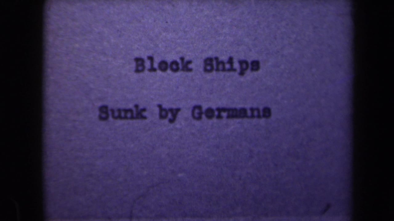 1946 Netherlands 8mm title card with typewritten text reading “Block Ships Sunk by Germans” against a purple-tinted field.