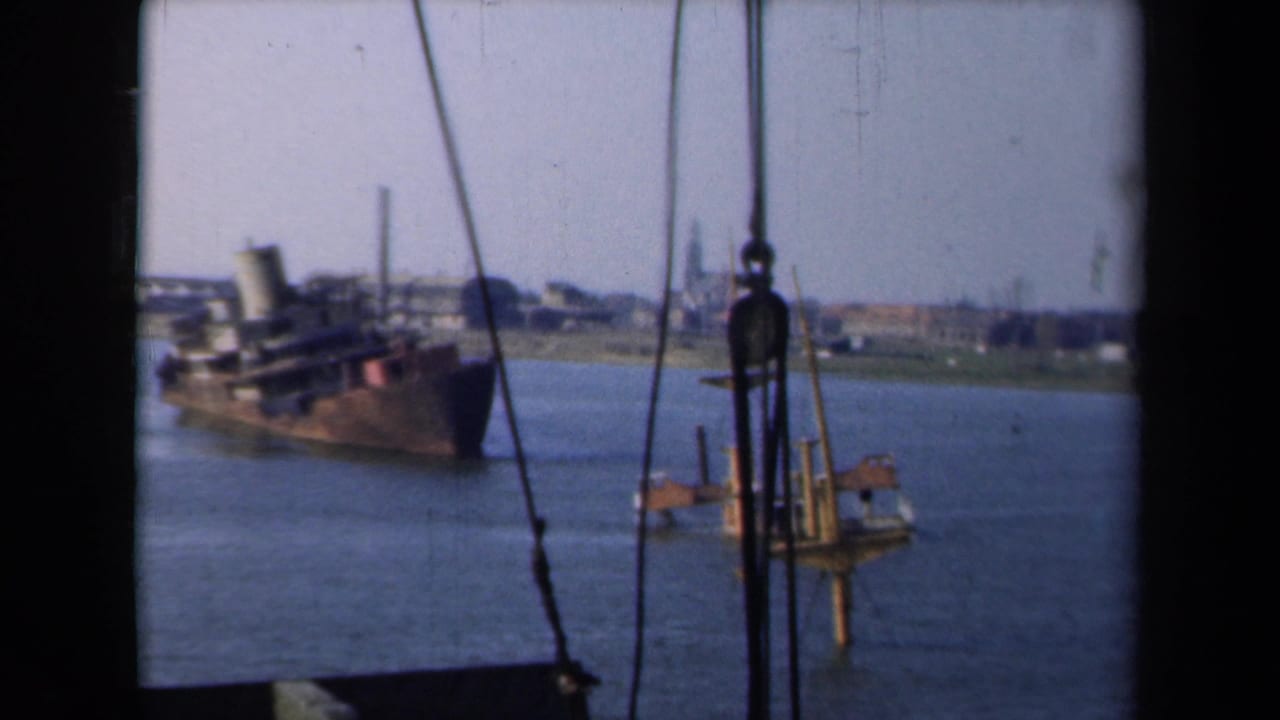 Damaged ship draws nearer with rigging lines crossing the frame.