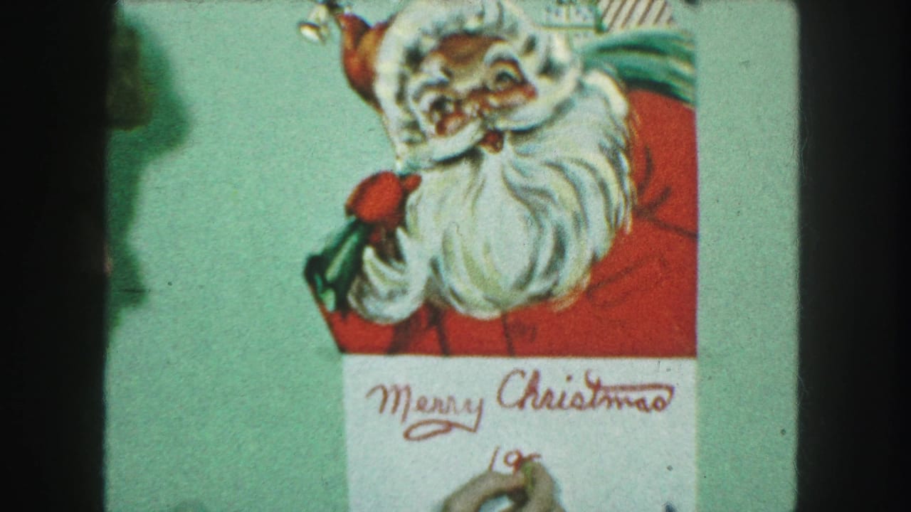 Santa illustration above a white card with red Merry Christmas lettering and a hand beginning the date.