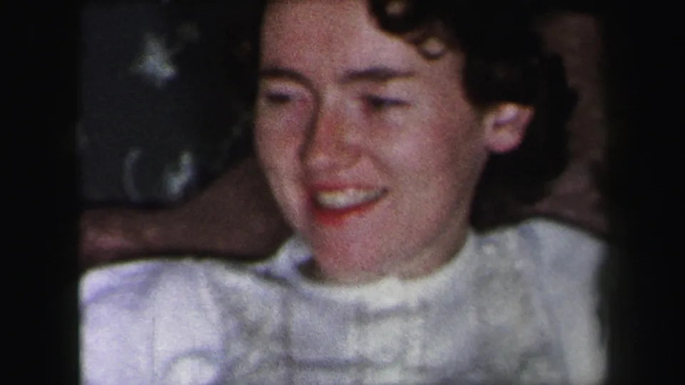 The 1975 Lynbrook frame shows a young woman in white smiling broadly in a softly lit private interior.