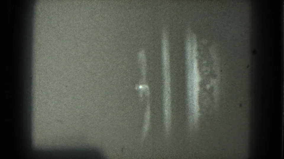 1975 8mm San Francisco frame where the dancer becomes an abstract pale blur near the right edge.