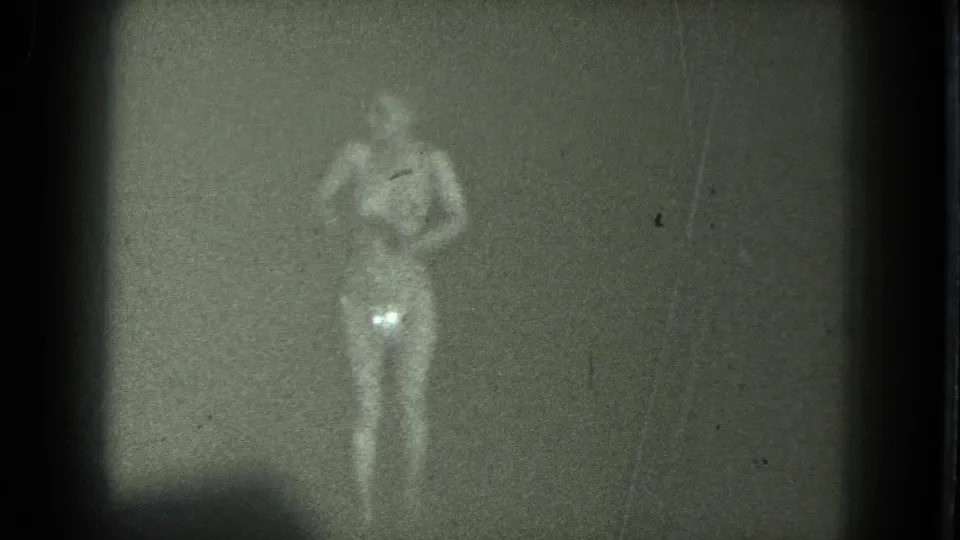 The final frame shows the dancer front-facing with arms near the chest, rendered faintly by low-light 1975 8mm film.