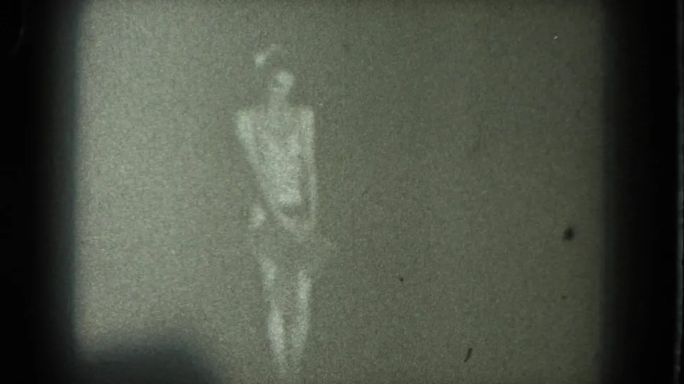 The final frame shows the adult dancer standing in low light, her outline blurred by motion and heavy 8mm grain.