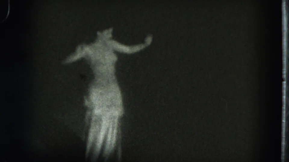 The final frame holds the dancer against a dark background, her shimmering gown and raised arm forming a soft silhouette.