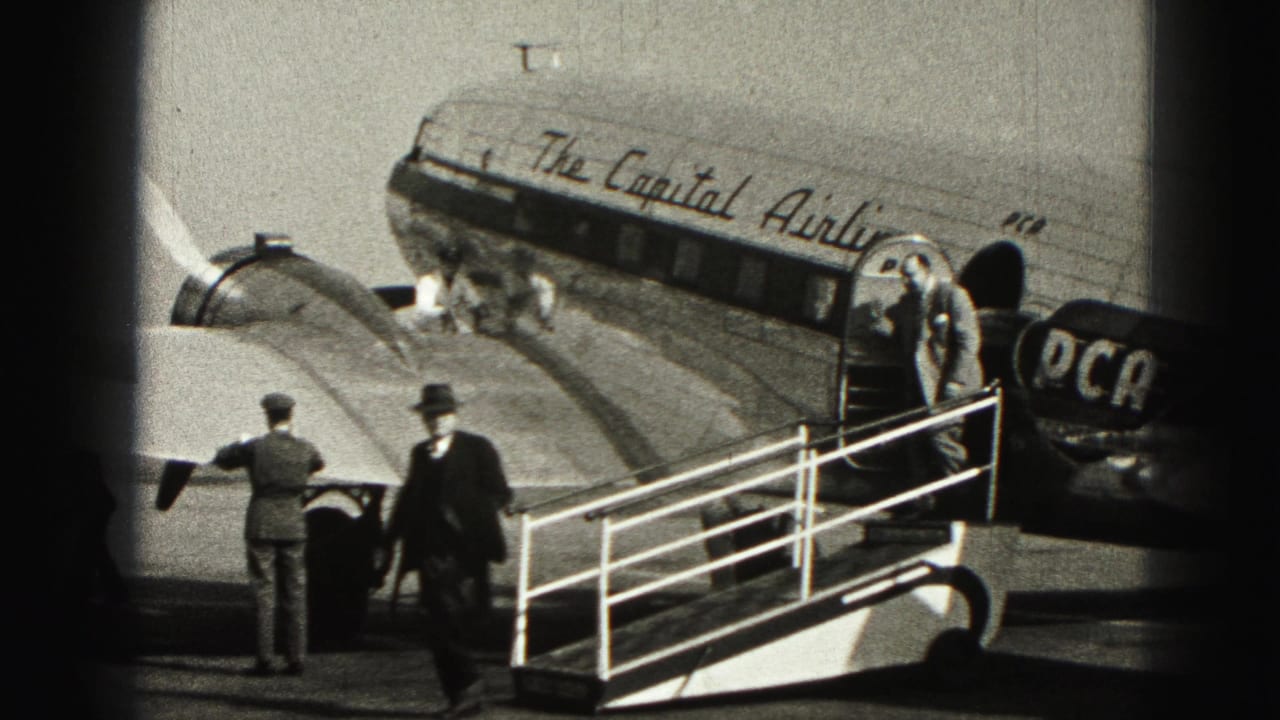 Passengers and ground crew appear beside the open door of a Capital Airlines plane at Harrisburg, Pennsylvania.