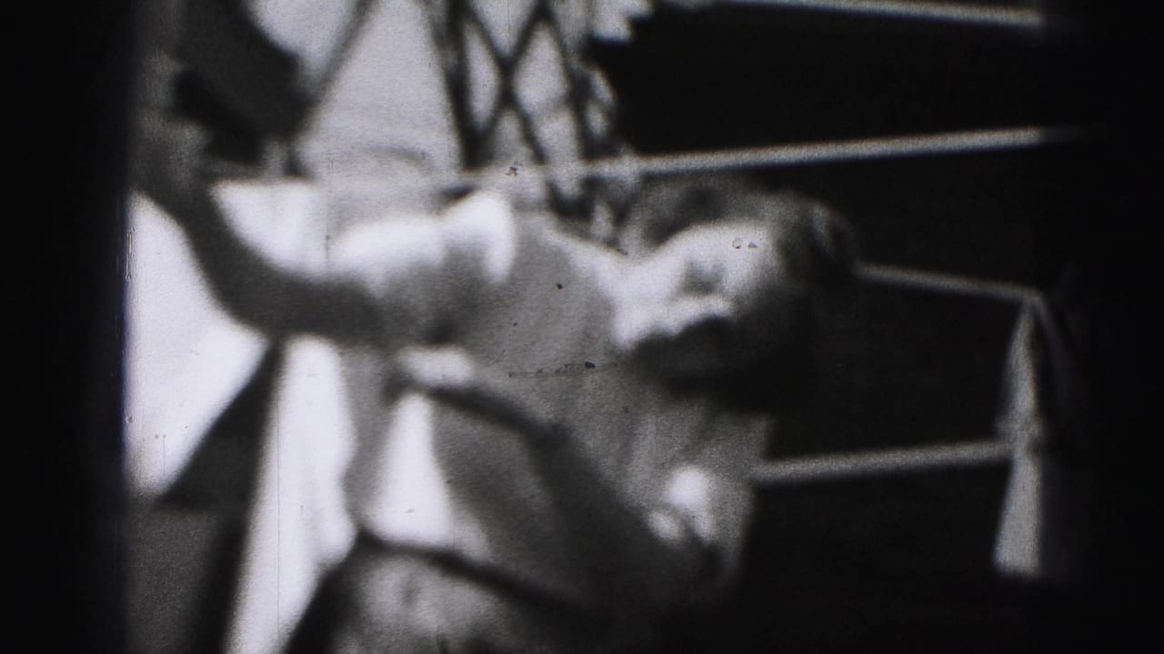 Close view of a woman securing laundry on a clothesline with clothespins.