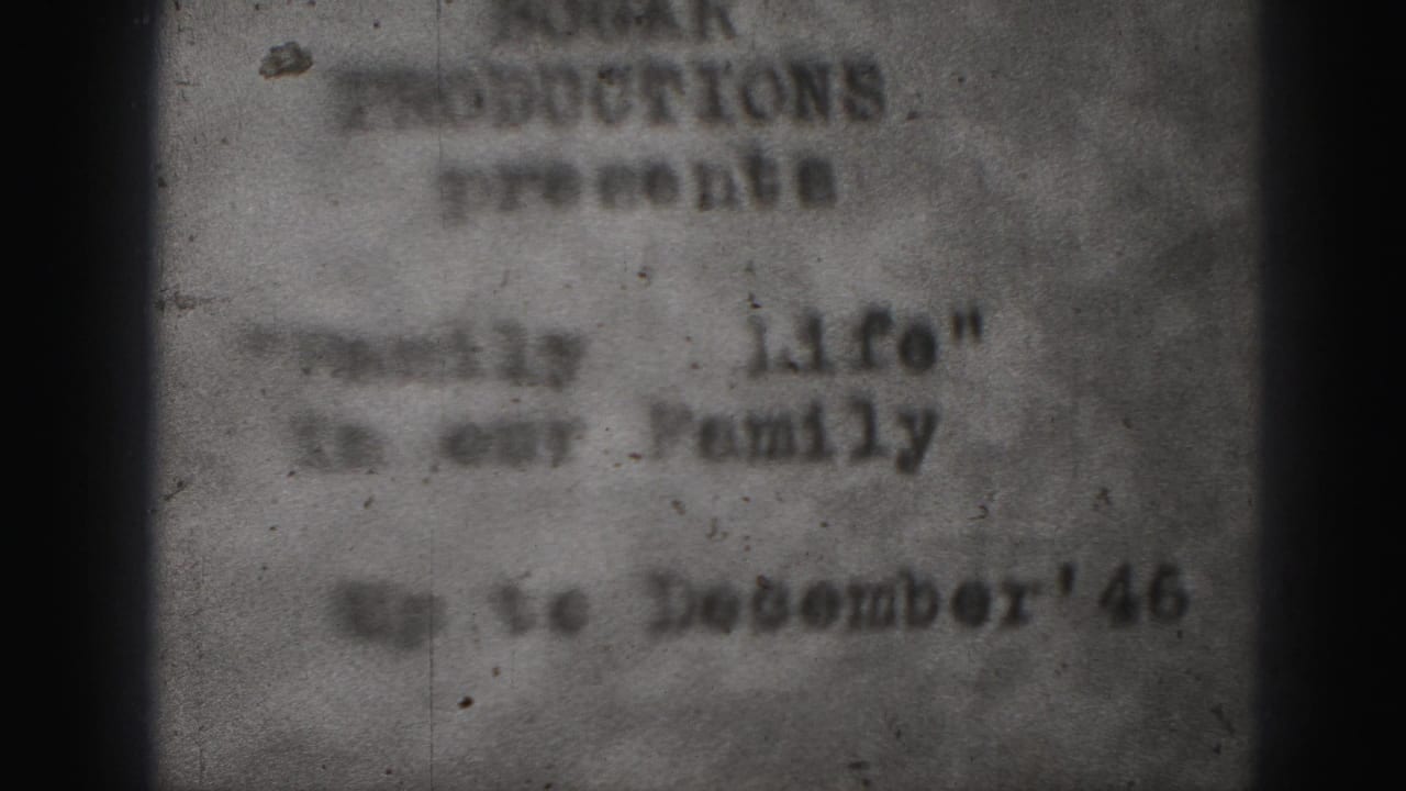 Second blurred view of the typed title card with film grain and dark borders.