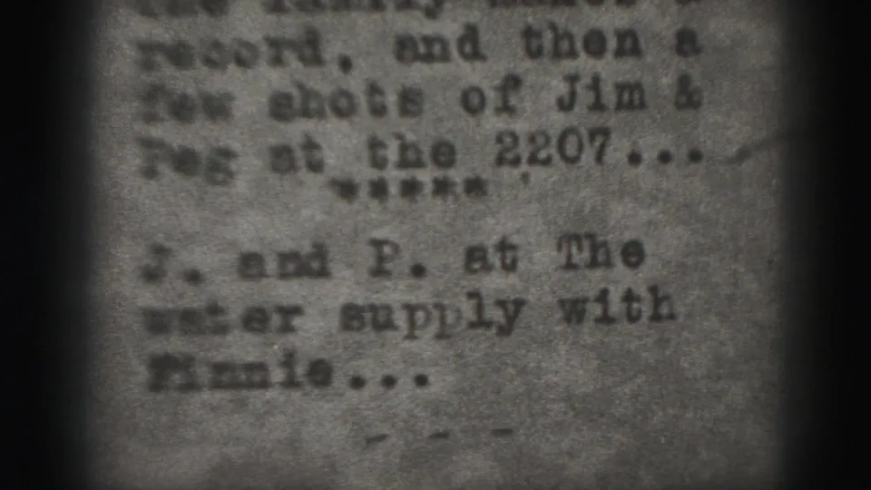 Grainy 8mm frame from Harrisburg showing typed notes with partial references to Jim and Peg.