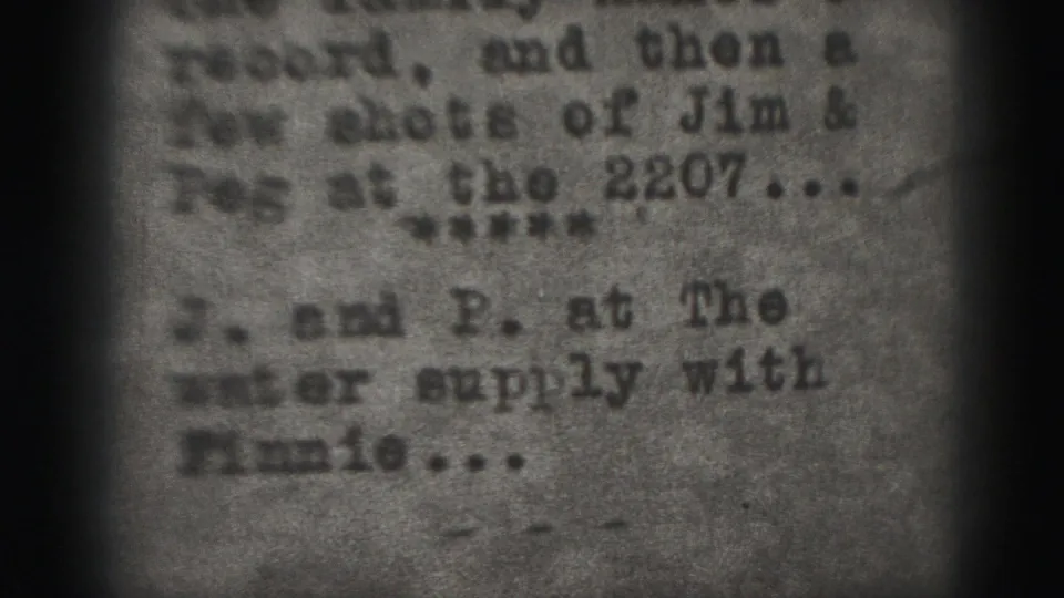 Soft 1975 home-movie close-up of typed text referencing a water supply and Finnie.