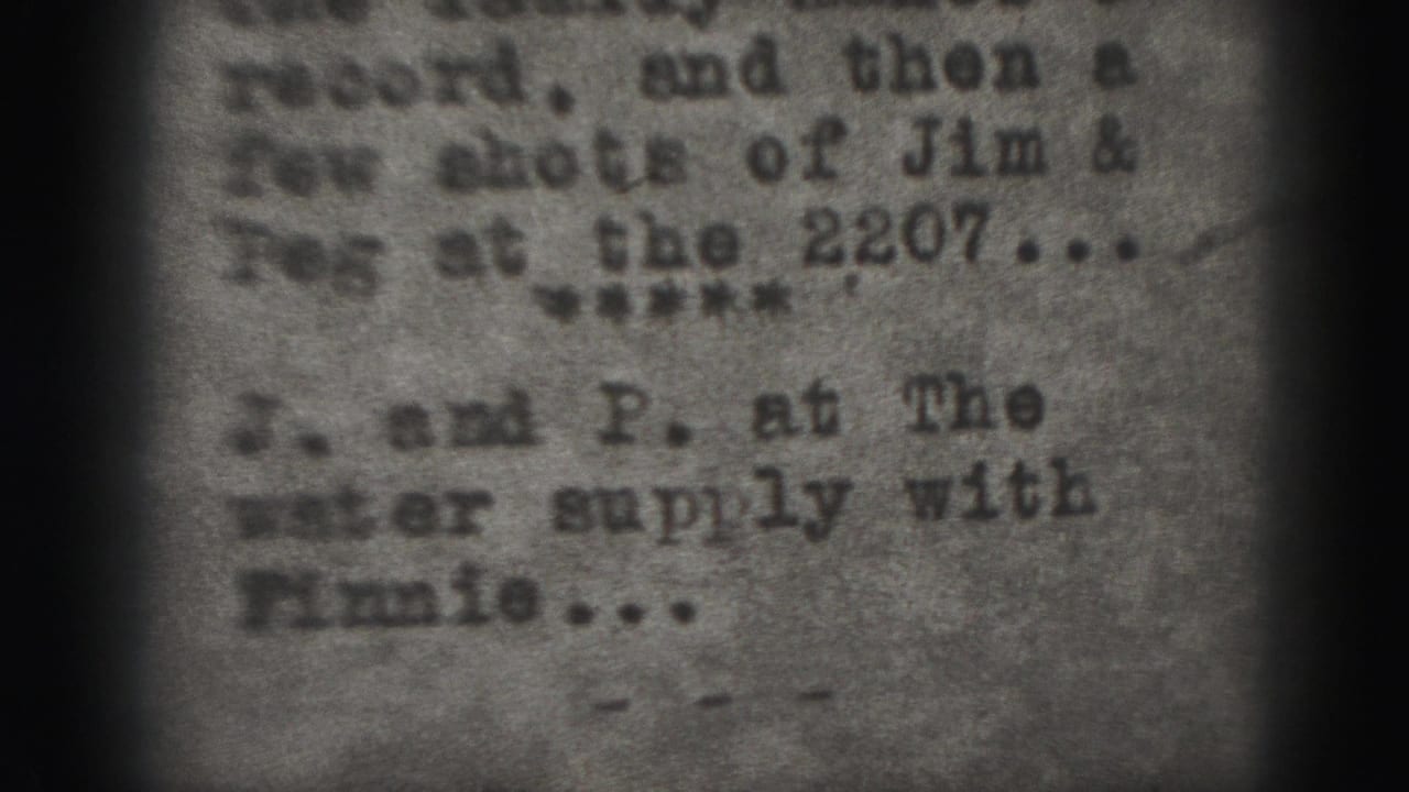 Soft 8mm frame showing blurred typewritten text and dark film borders.