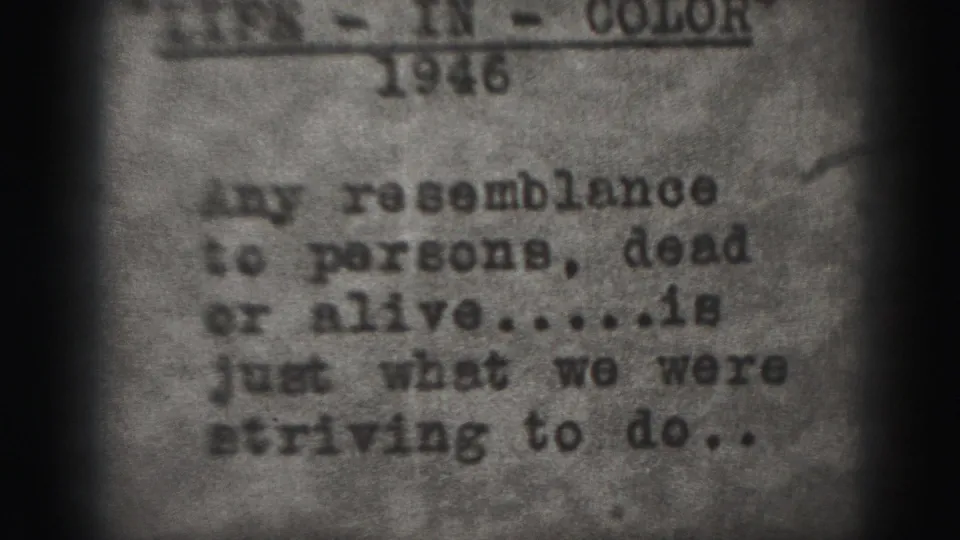 1975 Harrisburg 8mm frame with a typewritten film disclaimer, visible year text, grainy paper surface, and vignetted 8mm edges.