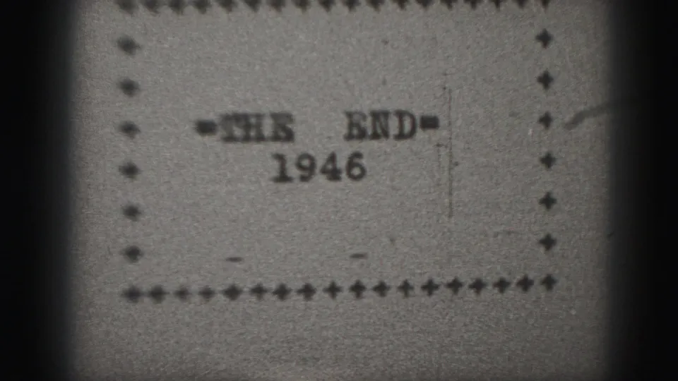 1946 8mm end card reading THE END, dated 1946, surrounded by a simple decorative border on gray paper.