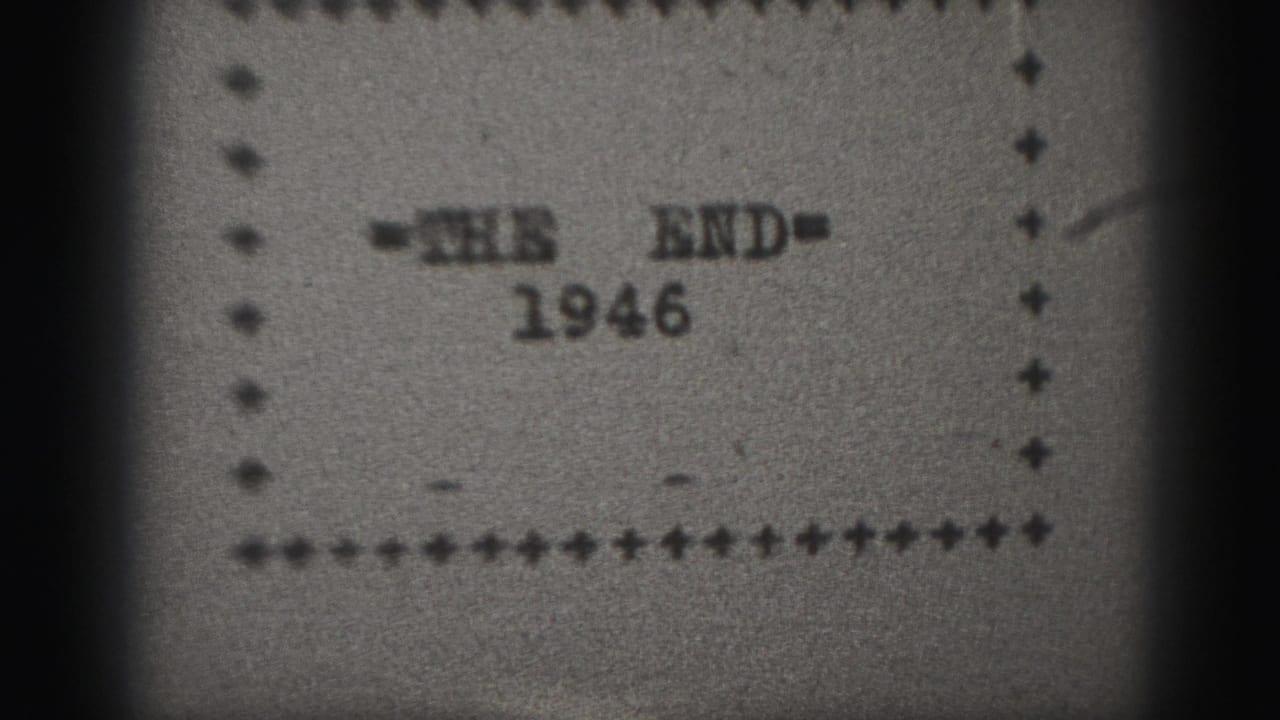 1946 black-and-white 8mm end title card with '=THE END=' and the year below, framed by a dotted border and film-edge shadowing.