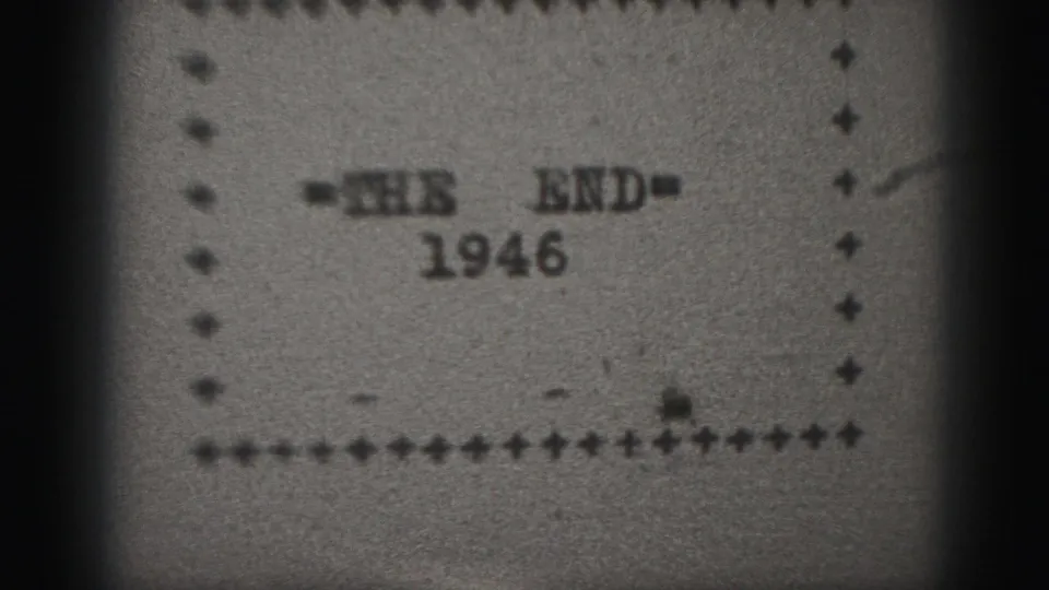 Soft 8mm frame showing a 1946 end title card, with '=THE END=' over the year and a dotted rectangular border.