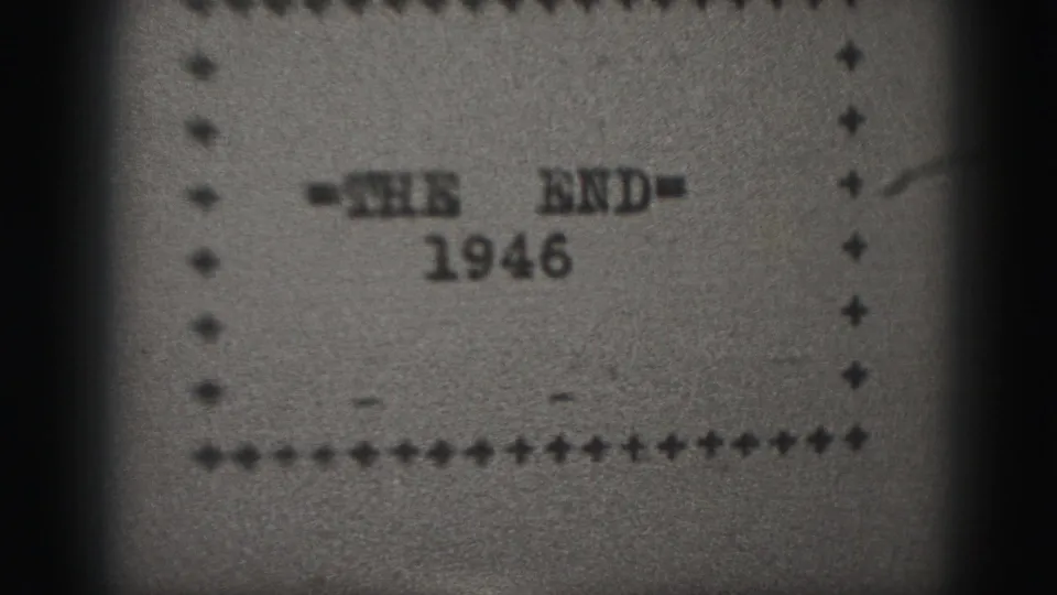 Archival 8mm title card from 1946 showing '=THE END=' above the date, with visible grain, dust, and a dotted border.