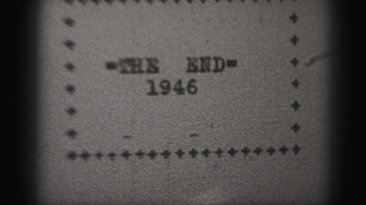 Blurred 8mm title card reading "=THE END=" above "1946" inside a dotted border.