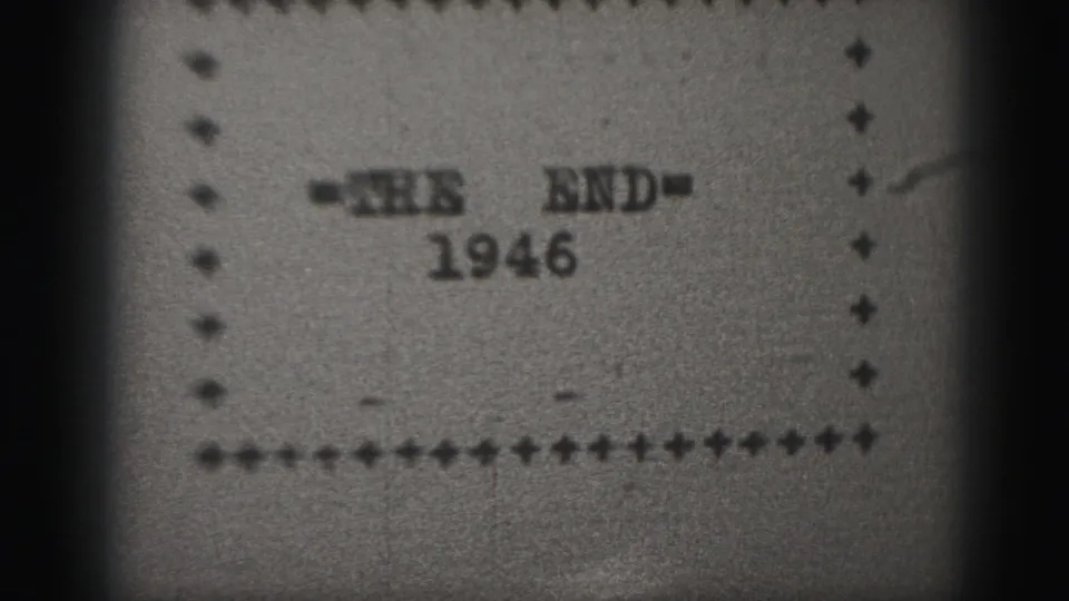 1946 home-movie end title card on 8mm film, with typed lettering, dotted border, grain, and dark edge vignette.