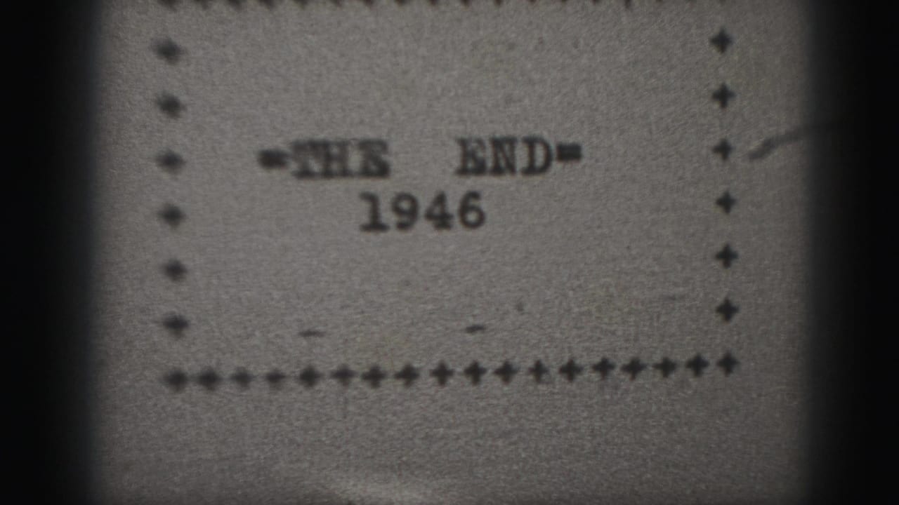 Close 8mm frame of a 1946 end title card, showing soft focus, dotted border, grain, and a dark vertical film edge.