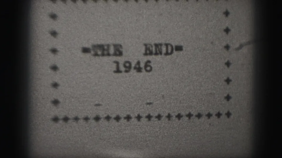 1946 8mm home-movie end title reading "=THE END=" with the year below, framed by a dotted rectangle.