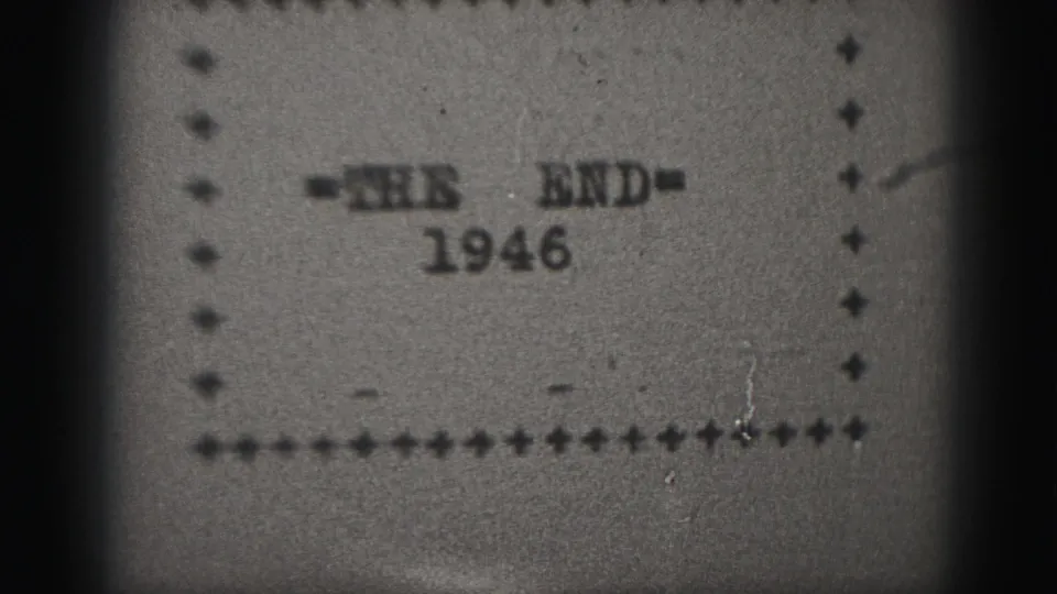 Soft 8mm frame of a 1946 end-title card, with typed-looking text centered inside a dotted border.