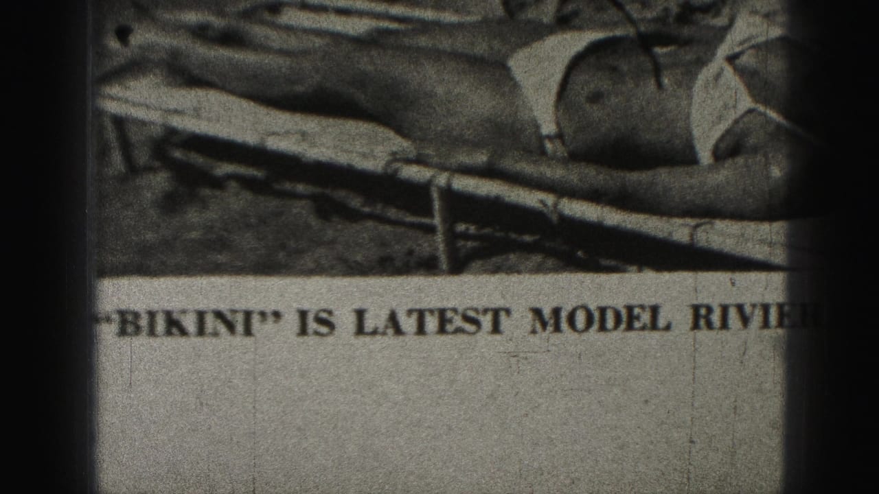 Printed ad detail with bikini model and the words “BIKINI” and “LATEST MODEL” partly visible.
