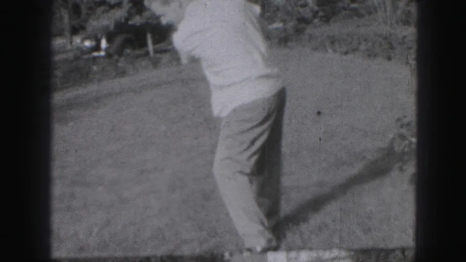 In the final frame, the adult golfer completes a swing on the lawn, his body turned away as the shadow stretches across the grass.