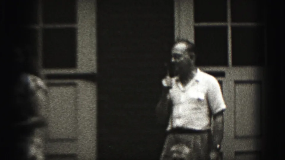 At the end of the brief 1975 Harrisburg shot, the man with the microphone stands near the doors while the woman exits the frame.