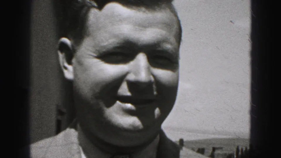 Near the end of the 1975 Harrisburg footage, the man smiles close to the camera in bright outdoor light with visible 8mm grain.