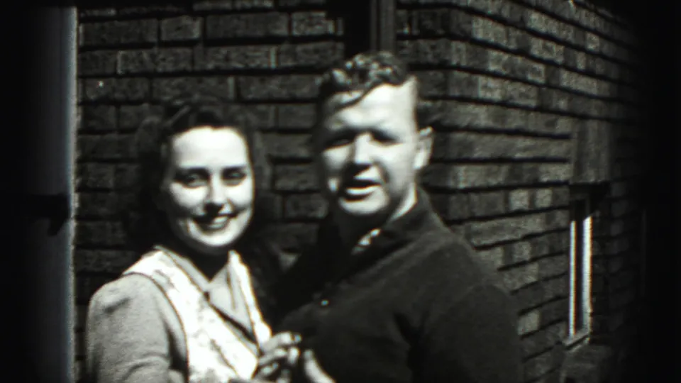 A woman in a light top and a man in a dark sweater pose closely in Harrisburg, Pennsylvania, according to supplied metadata.