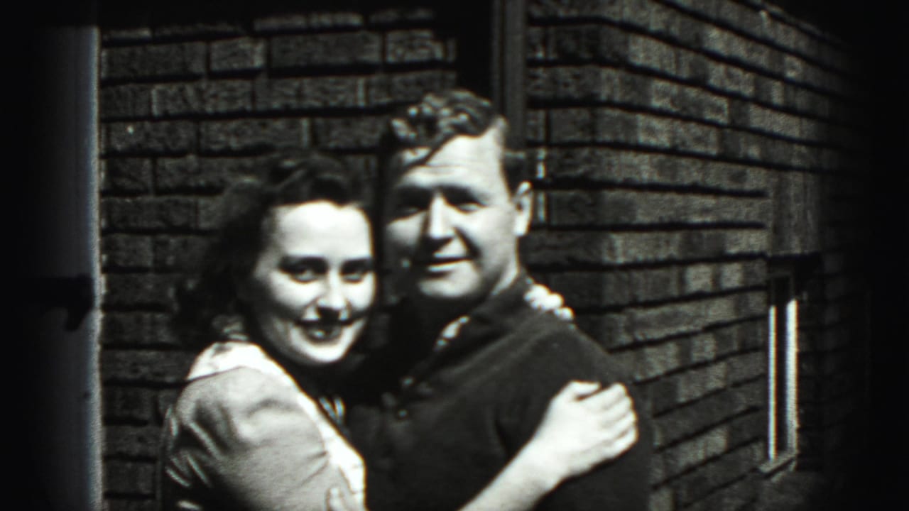 The young couple stands arm in arm and smiles toward the camera outside a brick building in Harrisburg, Pennsylvania.