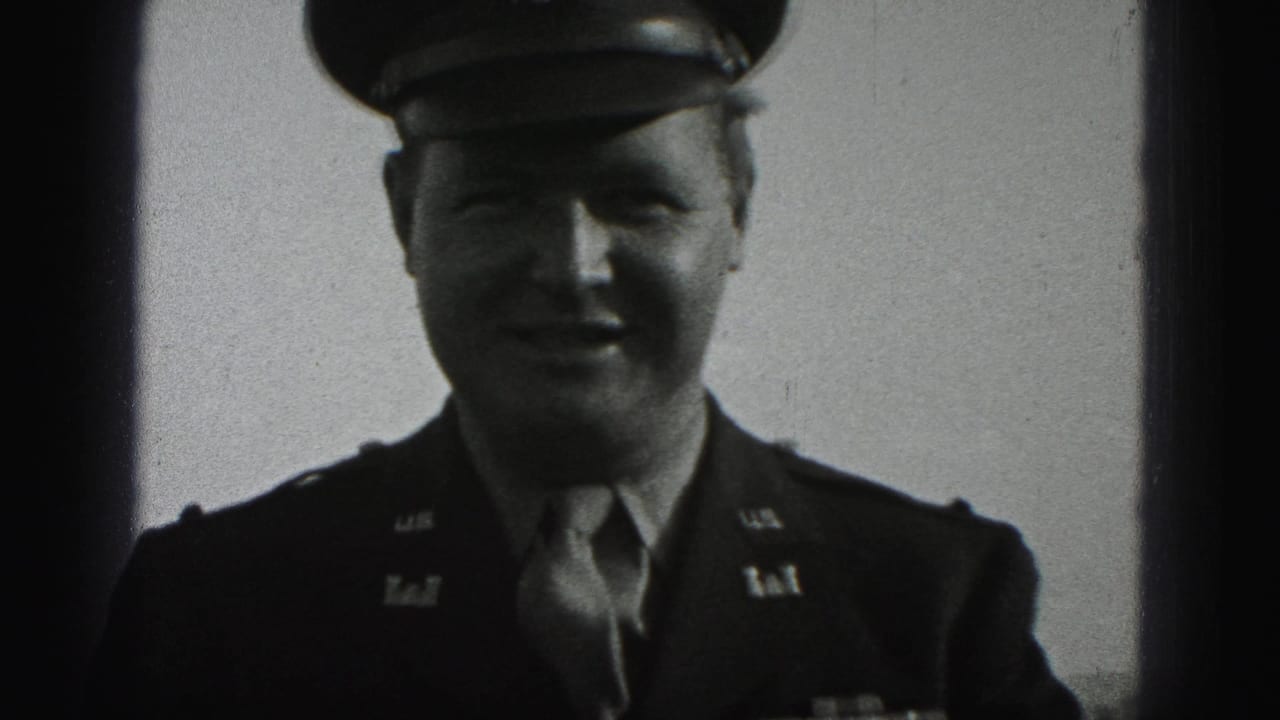 Uniformed soldier faces the camera in a dark dress jacket and cap.