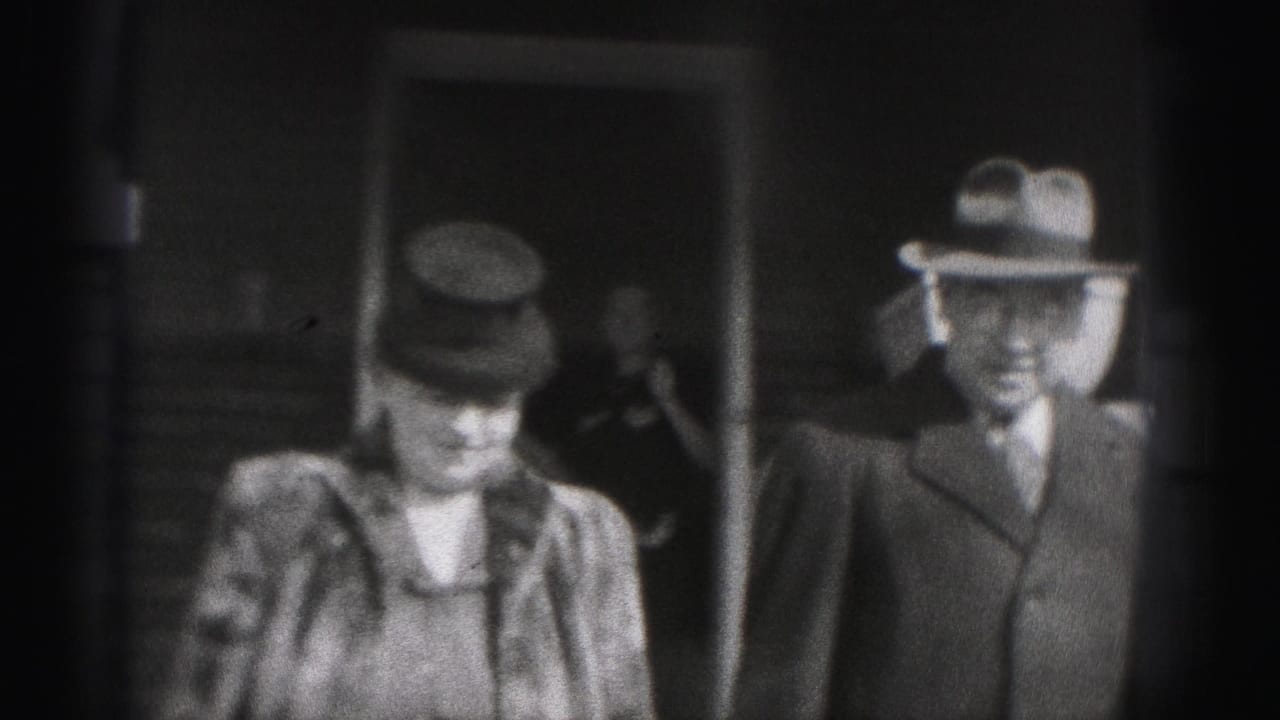 The Harrisburg 1975 frame shows a woman in a hat and coat near a suited man outside a building entrance.