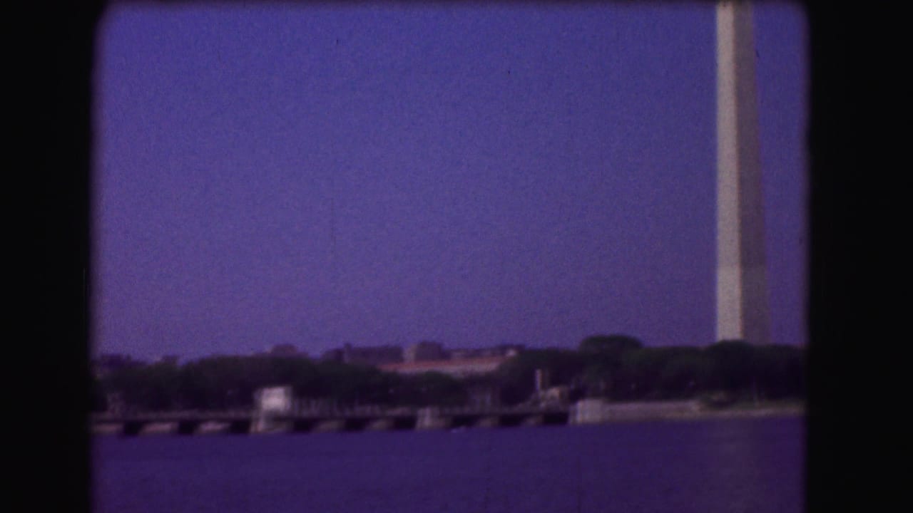 Waterfront view with shoreline, pier structures, and the monument edge at right.