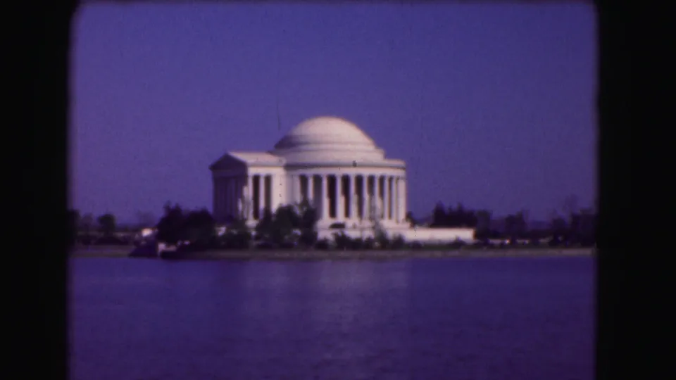 Washington, DC landmark view showing the Jefferson Memorial across the Tidal Basin with a soft 8mm home-movie look.