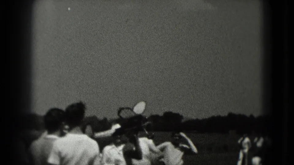 Visitors near the Lincoln Memorial area in Washington DC watch as a small toy airplane appears above the group in grainy 1975 8mm footage.