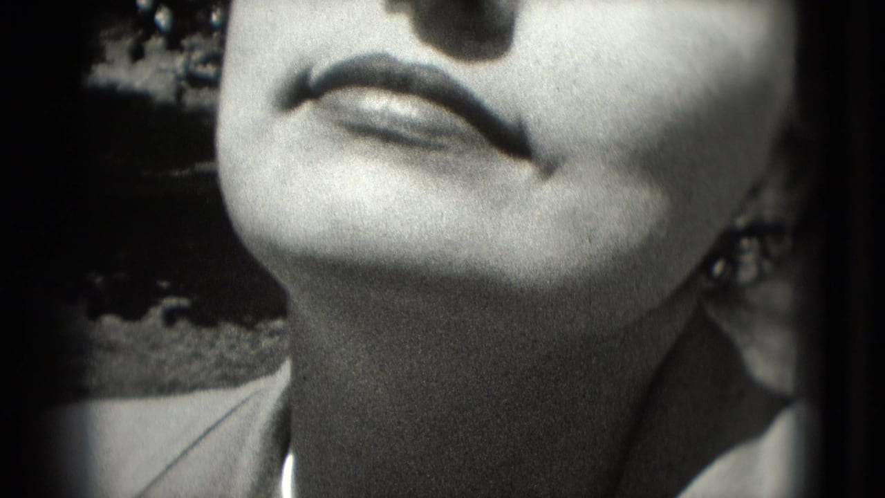 1975 Washington, DC 8mm close-up of an adult woman tilting her face toward sunlight, with lips and closed eyes partly cropped.