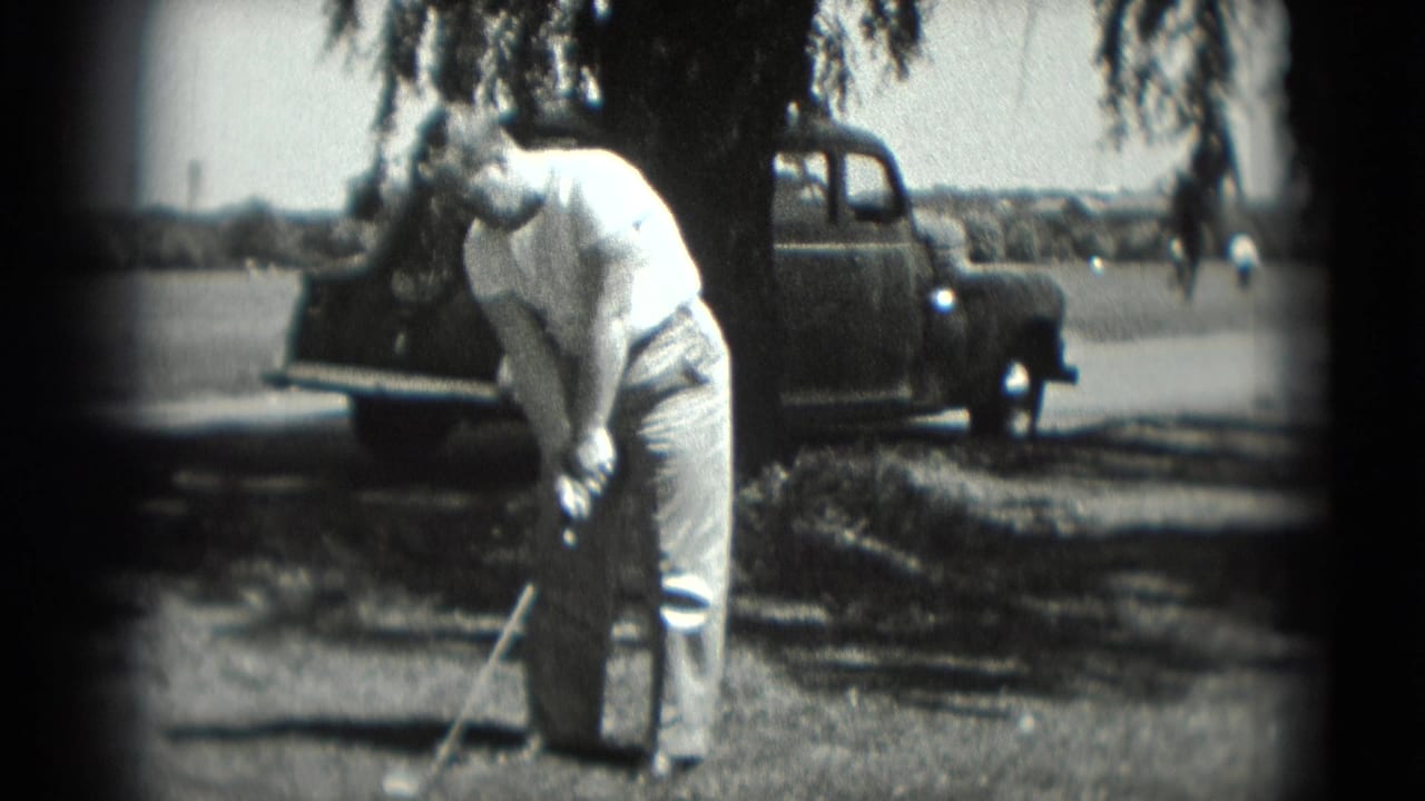 The golfer continues setting up his shot in a shaded outdoor Washington, DC scene with a vintage-looking car nearby.