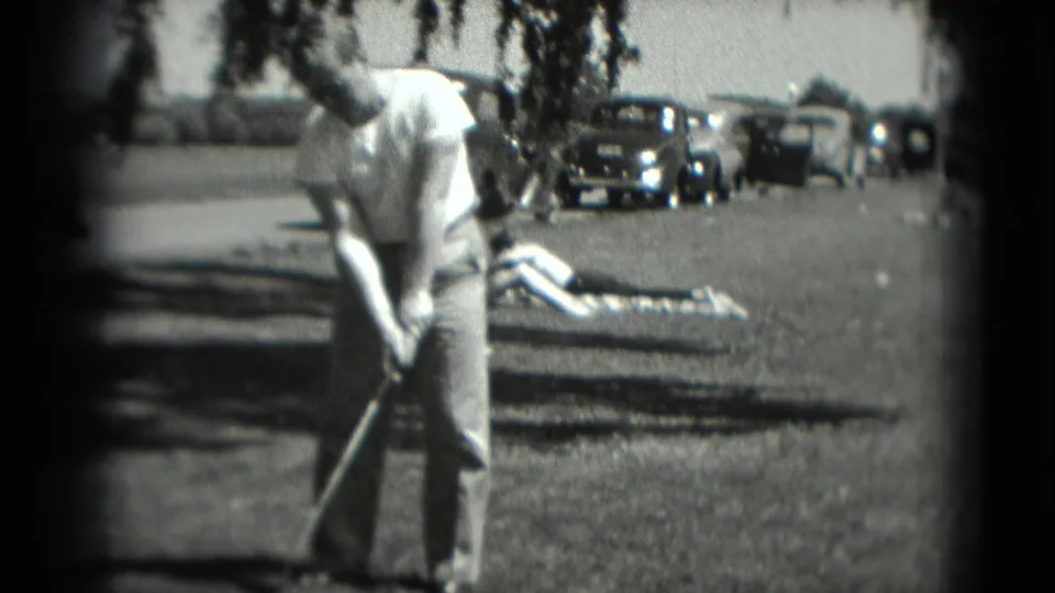 The final frame shows the man with his golf club on a grassy Washington, DC area, with tree shade, parked cars, and a person on a blanket behind him.
