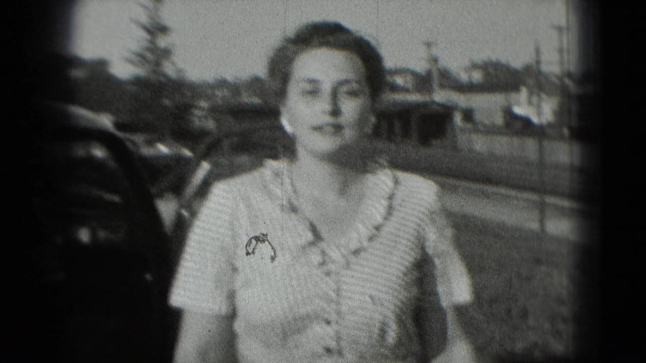 Smiling woman standing close to a parked car outdoors.