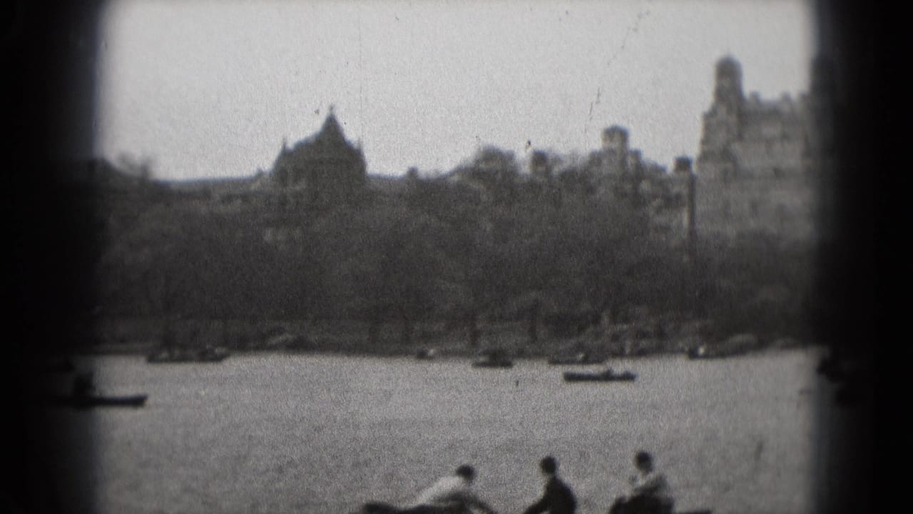 1975 Washington, DC park footage showing rowboats on a lake with visitors seated along the lower edge of the frame.