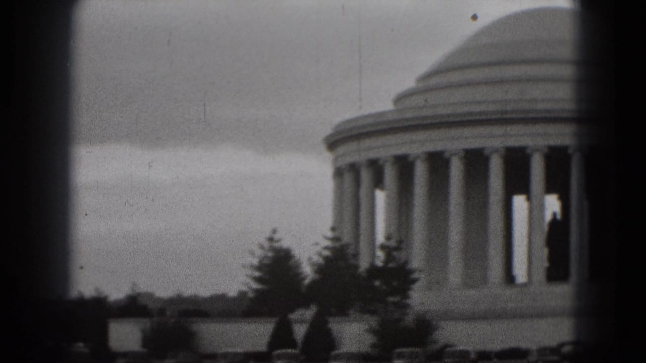 Soft 8mm view of the Jefferson Memorial with columns, dome, trees, and dark frame edges.
