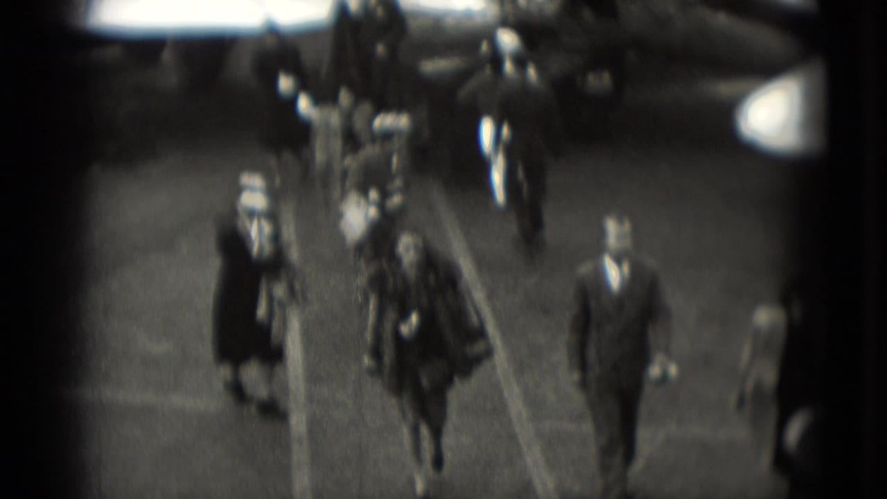 In Washington, DC 1975 home-movie footage, well-dressed travelers walk across a tarmac after leaving an aircraft.