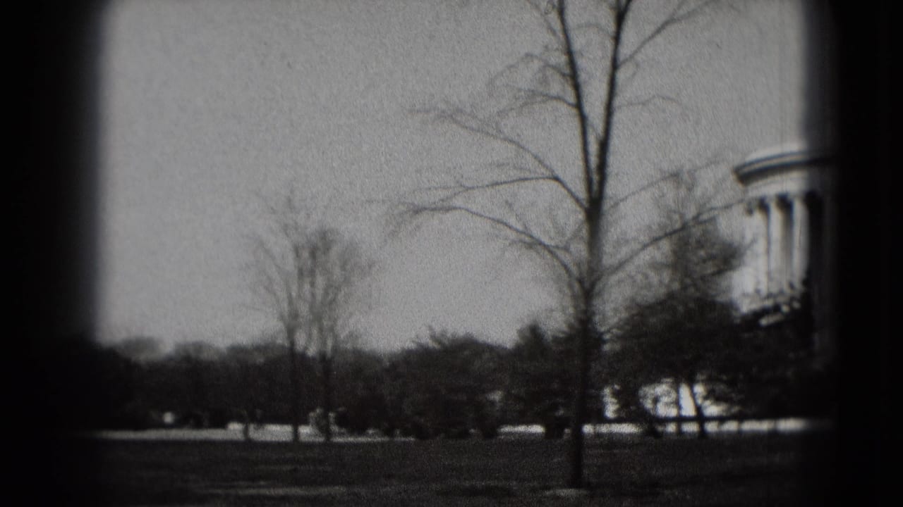 The camera pans across Washington, DC parkland as part of the Jefferson Memorial begins to appear at the right edge.