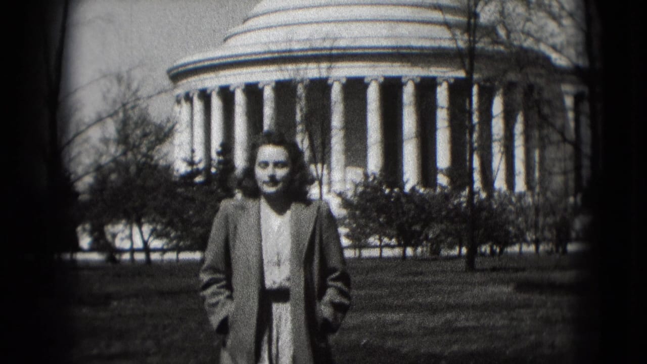 Woman standing on grass in front of the Jefferson Memorial.