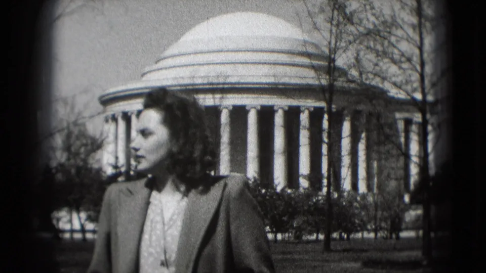 Closer profile view of the woman in front of the Jefferson Memorial during a Washington DC home-movie shot.