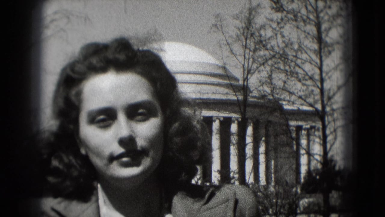 Young woman in 1975 Washington, DC appears outdoors before the Jefferson Memorial, with bare trees and columns behind her.