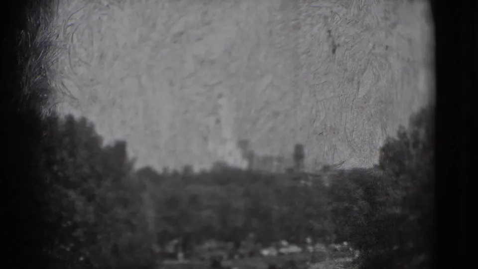 1975 Washington, DC landscape view with trees and distant vertical forms, recorded in soft black-and-white 8mm texture.